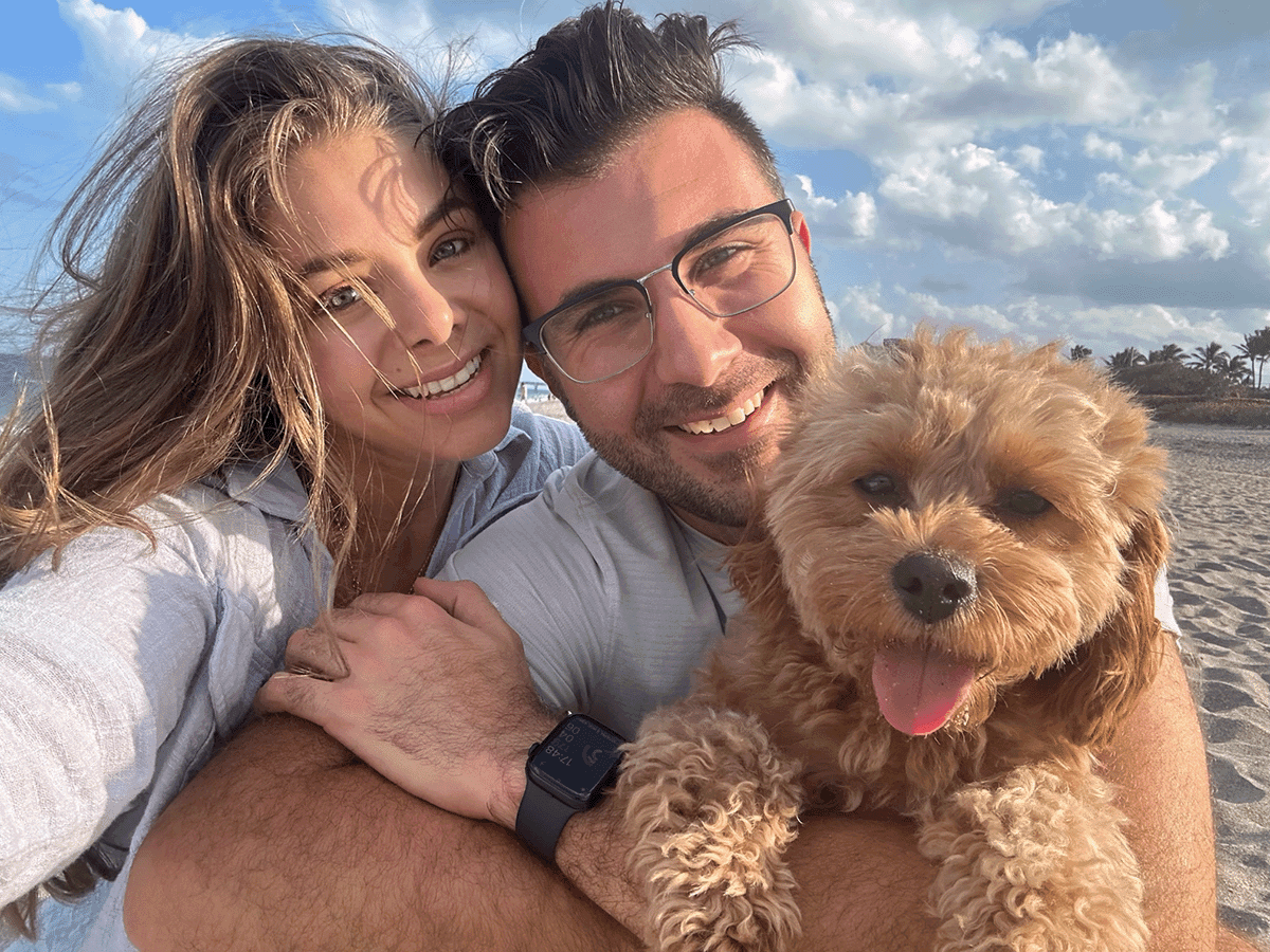 Andreas Stamatakis, his wife Sophia and their dog Meli on the beach